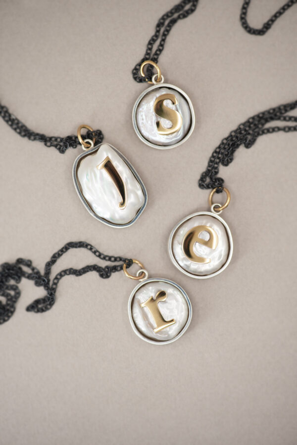 Serif on a Pearl necklaces